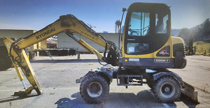 Combo Máy đào bánh lốp Hyundai Robex 555W đời 2008 và búa thủy lực
