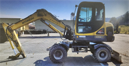 Combo Máy đào bánh lốp Hyundai Robex 555W đời 2008 và búa thủy lực